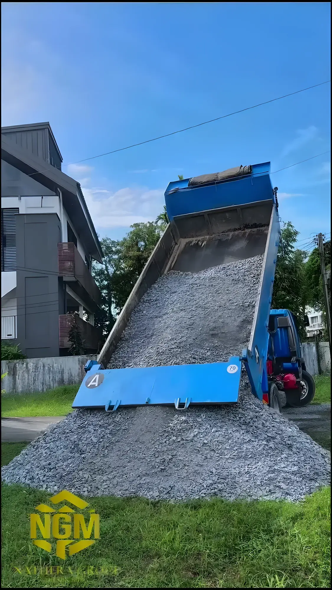 Tipper lorry unloading crusher run onto the cleared site.