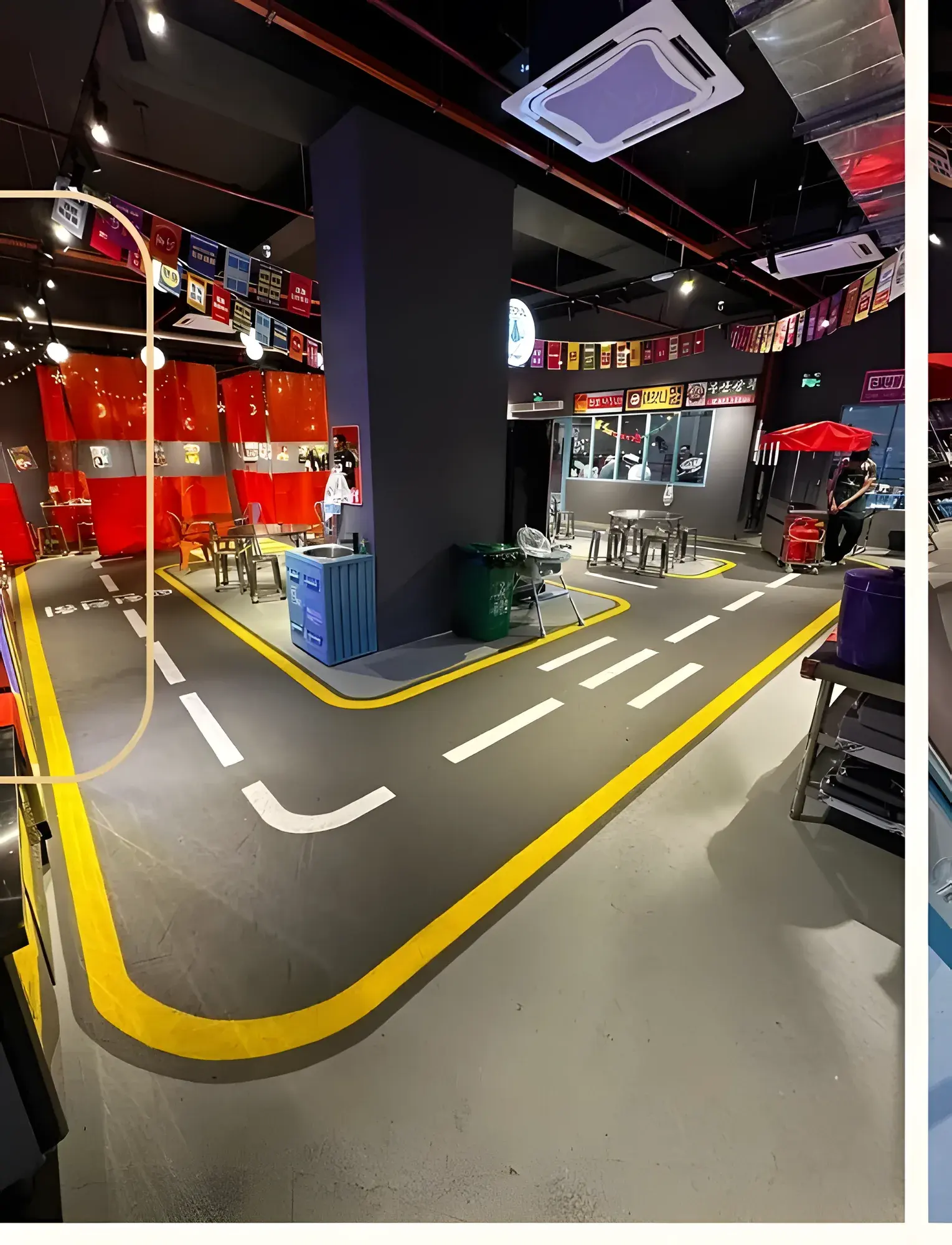 The finished café: road-themed epoxy floor, counter and seating.