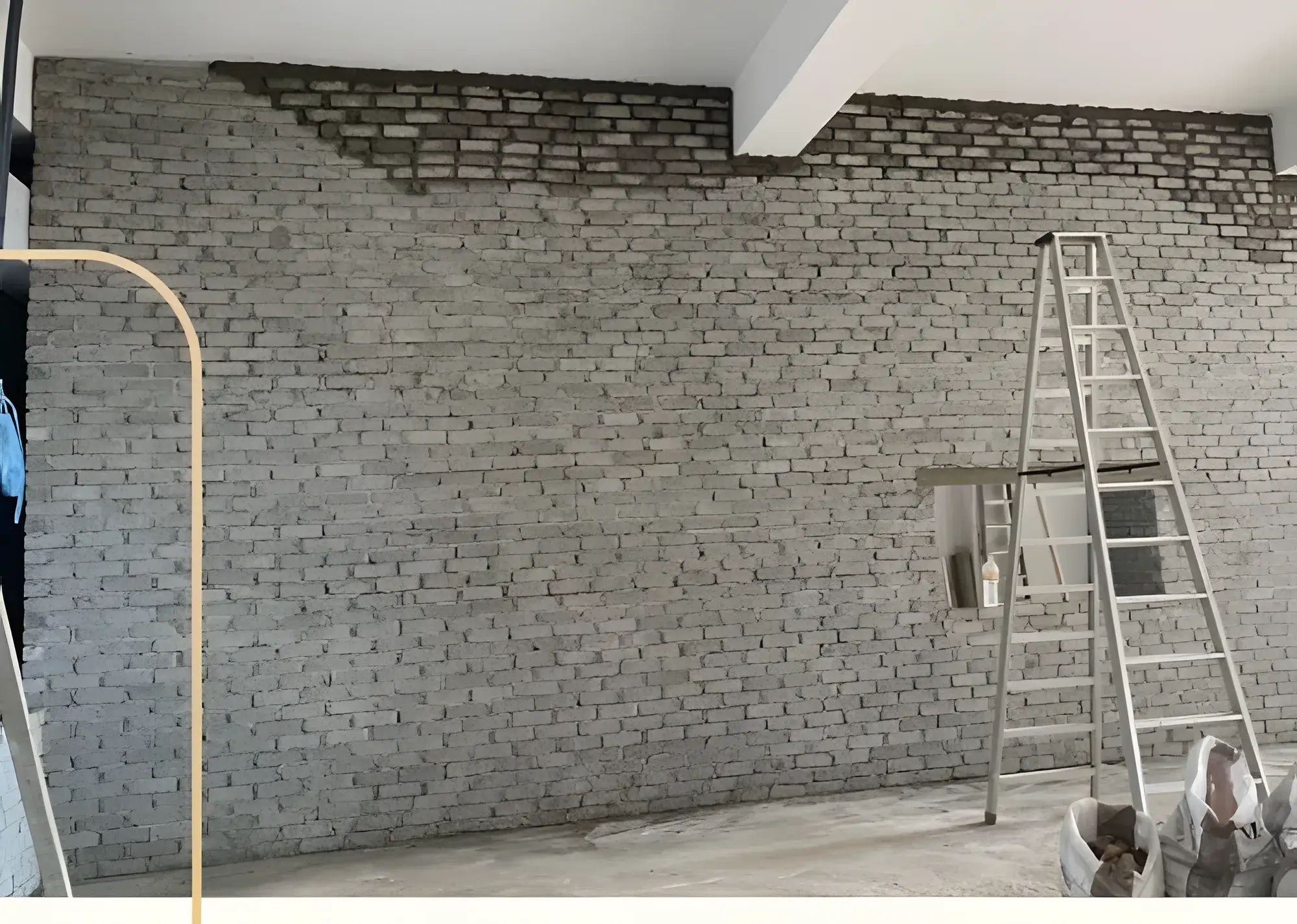 New brick wall going up for the kitchen.