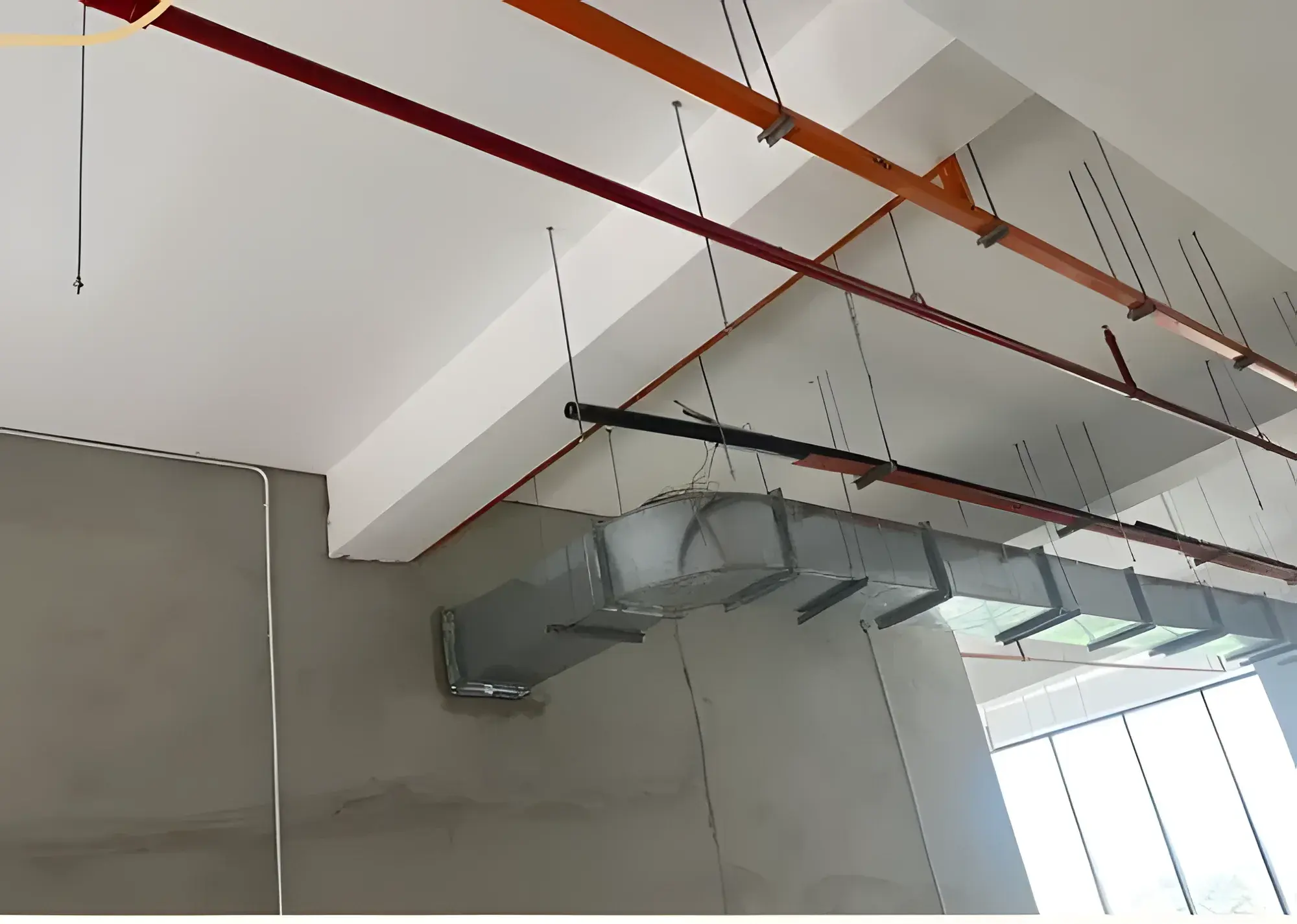 Exhaust ventilation ducting run across the ceiling.