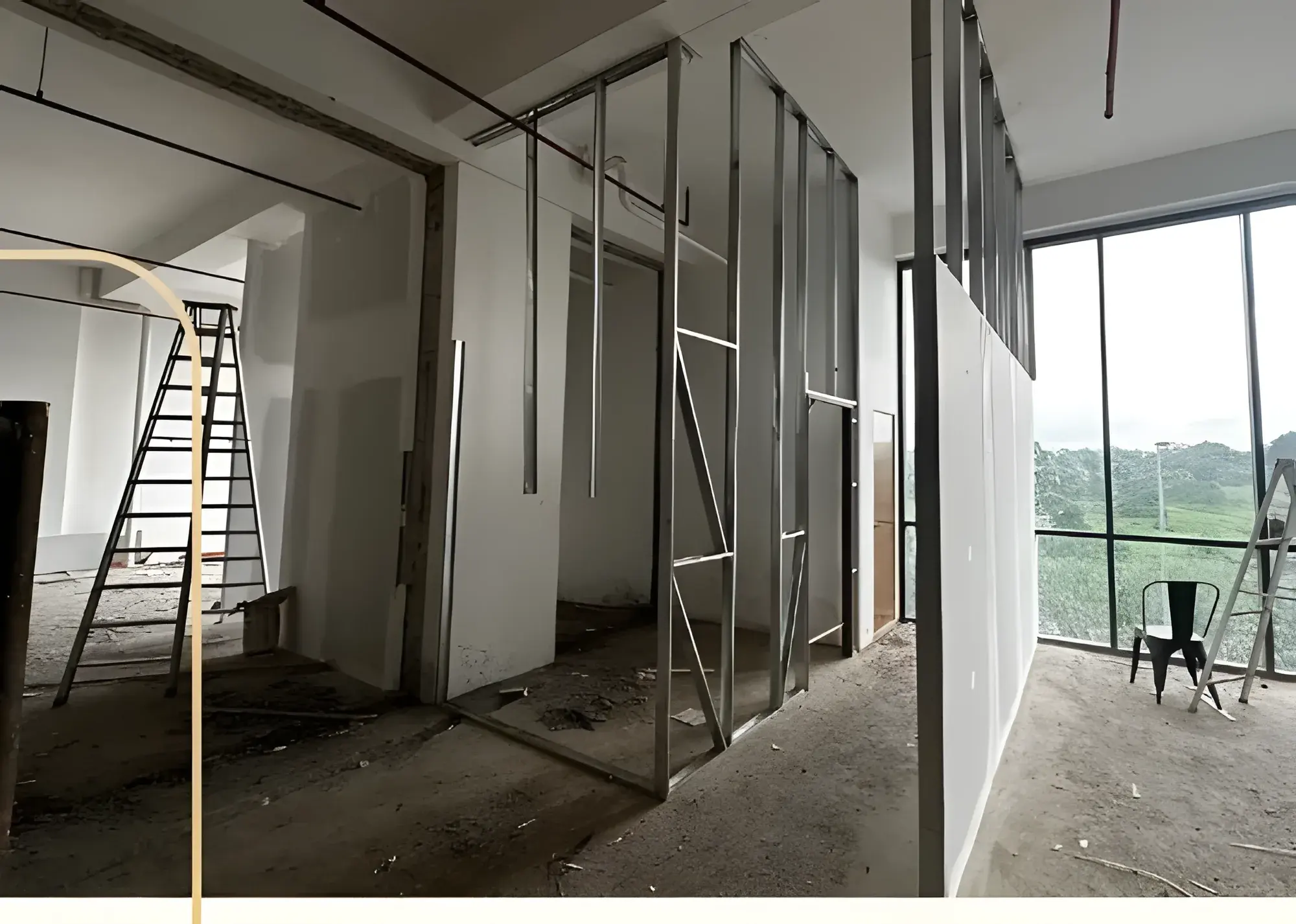 Metal stud partitions framing the back rooms.
